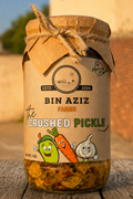 Jar of 'The Crushed Pickle' from Bin Aziz Farms with a rustic background